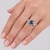 Fancy Blue and White Diamond 3-Stone Baguette Engagement Ring On Hand