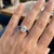 Oval Lab Grown Diamond and Baguette Sapphire 3-Stone Engagement Ring On Hand