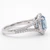 Oval Lab Grown Blue Diamond Halo Engagement Ring With Split Band Side
