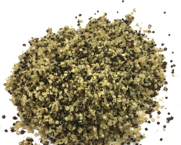 Cooked and dried tricolor instant quinoa, a colorful blend of three seeds - golden, red, and black. 