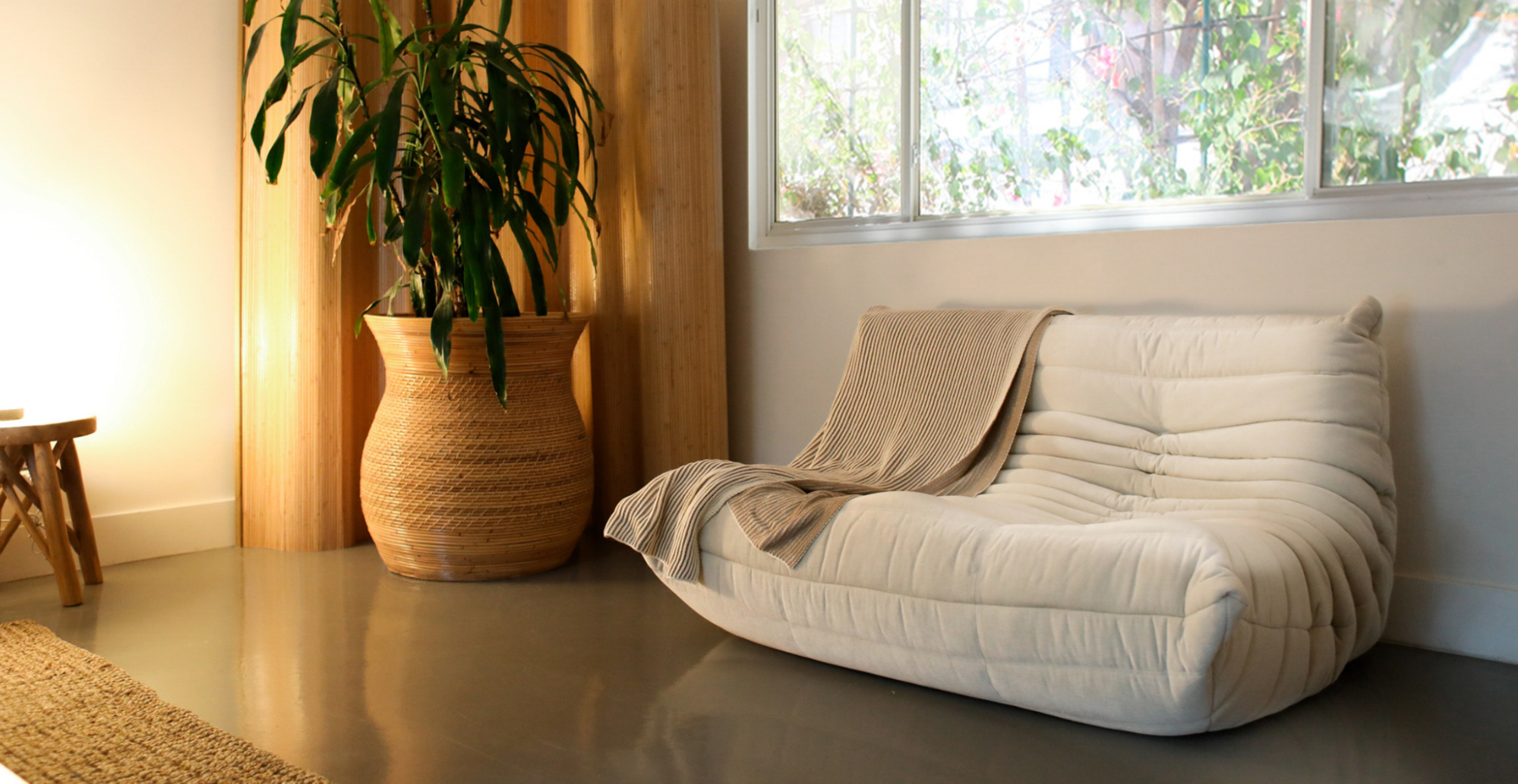 beige-michel-ducaroy-loveseat-in-warm-living-room.png