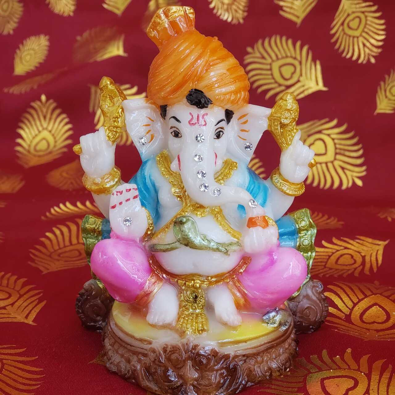Multicolor Ganesha Statue/ Idol seating on Wood (Small)