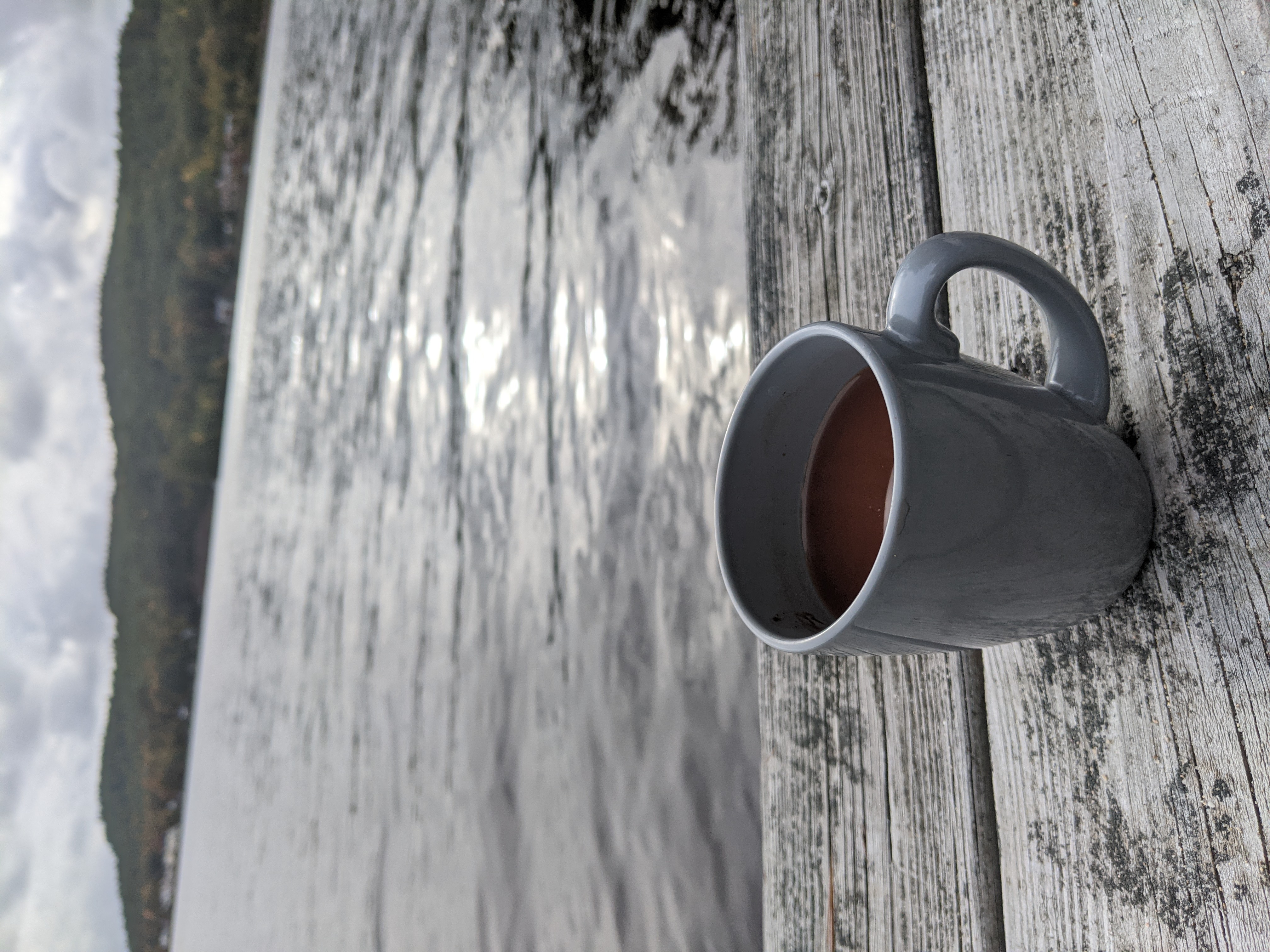 Vocoa Hot Cocoa on a dock at a lake