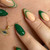Emerald green gel nail polish in bottle Emerald green gel nail polish in bottle