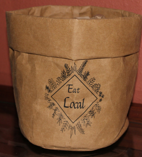 EL001 Eat Local Washable Paper Bag $12.95 each . 
Eat Local Washable Paper Bag Comes flattened and you will need to fold down 2 to 3 times to decide on the height you would like the bag to be.  
 After being folded down they are about 7 inches high and 6 inches wide...  Add a couple of inches if you don't want them folded down at the top. 