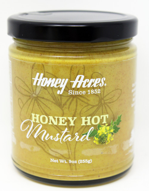 8168 9oz Honey Acres Honey Hot Mustard Kosher, Honey Acres Honey Hot mustard is a mild back of the tongue kind of honey hot. This mustard has a great zing flavor with underlying hints of honey. Amazing as a standalone dip and a great addition to any sandwich, this will be the talk of the party or bring your lunch to a whole new level. At only 5 calories per serving it makes a perfect guilt-free addition! Because we make our Honey Mustards with nearly 30% honey, they glaze wonderfully on meats when prepared properly, so spread some on your next ham or salmon dinner to add a great Honey Dill taste. Gluten Free