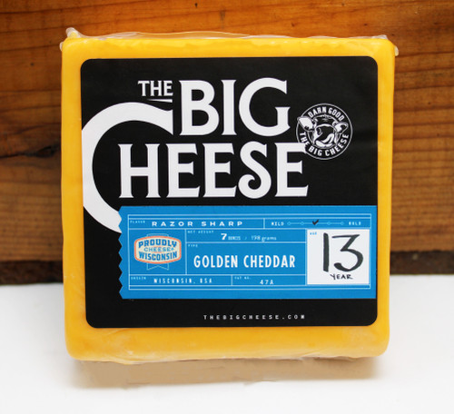 TBC 7oz 13yr Old Glorious Golden Aged Cheddar SQ, 13 is a lucky number when it comes to aged cheese, it’s the deliciously crunchy calcium crystals in our finely aged 13-year golden cheddar cheese. This incredible cheese has a slightly crumbly, perfectly creamy texture and a bold flavor that is nutty, tangy, and just a little bit feisty.