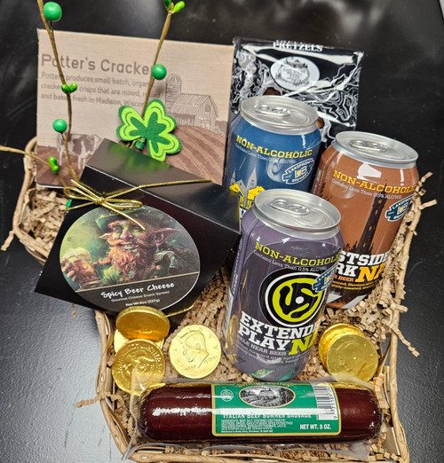 Celebrate St. Patrick’s Day with this charming Wisconsin-themed gift basket, perfect for beer lovers and snack fans alike. This basket features a great selection of local flavors and festive treats, all beautifully arranged in a sturdy basket shaped like the state of Wisconsin.

Includes:

Lakeside Brewery Near Beer Cans: Pale, Amber, and Dark

6 oz spicy beer cheese from The Leprechaun

5 oz beef summer sausage

Potter’s crackers

2 oz dipping pretzels from Eastshore

5 chocolate gold coins

A fun and festive basket that highlights Wisconsin favorites — ideal for gifting, raffles, or St. Patrick’s Day celebrations.