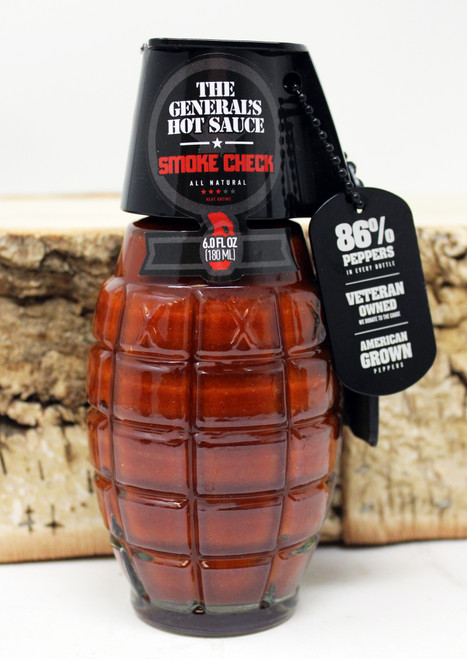 GHS15 Smoke Check The General's Hot Sauce 6oz, Glass Jar in the shape of a hand grenade, HEAT: 3 OUT OF 5 MEDIUM HEAT
Smoke Check blends the bold bite of American-grown red cayenne peppers (the same ones used in Dead Red and Danger Close) with smoked chipotle, it is Dead Red's smoky alter-ego, except this one's been through the fire--literally, With the addition of slow-smoked chipotle pepper, Smoke Check carries a rich smoky flavor that balances heat with a deep, earthy finish. It boasts the same 86% peppers as the rest of our hot sauces, and brings a smooth, medium heat that doesn't overstay its welcome, it's perfect for anything that touches a grill, but just as comfortable on eggs, tacos, or a pulled pork sandwich, All Natural, Gluten Free and Vegan, American Grown Pepper, Veteran Owned Business,  ALL NATURAL, GLUTEN FREE, VEGAN