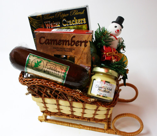 Gift 118 Northwoods Cheese You Sleigh Me! A hand made Willow sleigh holds delicious gourmet foods. This gift includes 5oz Northwoods All Beef Summer Sausage, 3.75oz Camembert Cheese spread, 1.4oz jar of mustard and 2oz of Water Crackers.