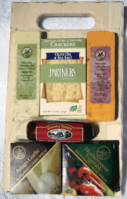 Gift 514 Rustic Wraps Distressed Savory Rect. American Hardwood Cutting Board Gift Contain 7oz of Wisconsin Cheddar with Onion and Chive Cheese, 7oz of Wisconsin Chipotle Cheese, 5oz of Smokey Valley Spicy All Beef Summer Sausage, 3.75oz of Asiago Garlic Cheese Spread, 3.75oz Of Mediterranean Vegetable Cheese Spread and .75oz of Partners Olive Oil and Sea Salt Crackers. All of these gourmet products are packed on a distressed all American Hardwood Cutting board, that measures 7x13x7/8". This gift is completely made by persons with disabilities. Gift 514 Rustic Wraps Distressed Savory Rect. American Hardwood Cutting Board Gift Contain 7oz of Wisconsin Cheddar with Onion and Chive Cheese, 7oz of Wisconsin Chipotle Cheese, 5oz of Smokey Valley Spicy All Beef Summer Sausage, 3.75oz of Asiago Garlic Cheese Spread, 3.75oz Of Mediterranean Vegetable Cheese Spread and .75oz of Partners Olive Oil and Sea Salt Crackers. All of these gourmet products are packed on a distressed all American Hardwood Cutting board, that measures 7x13x7/8". This gift is completely made by persons with disabilities.