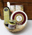 Gift 156M Hostess Mini Basket Merlet.  Adorable willow basket loaded with delicious treats! Contains 3.75oz of Mille Lacs Merlot Cheese Spread in reusable wooden cheese hoop, Mille Lacs 5oz Garlic All Beef Summer Sausage, Wood handle metal spreader knife, 1.4oz Mustard, 1.10 oz of Mille Lacs Tuscan Olive Oil Sea Salt Crackers.  Shelf Stable food gift.  Cheese and Sausage is made in Wisconsin