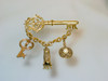 Large Key Brooch with Charms