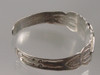 Bracelet marked Silver Products Coin Silver with an Arrow.