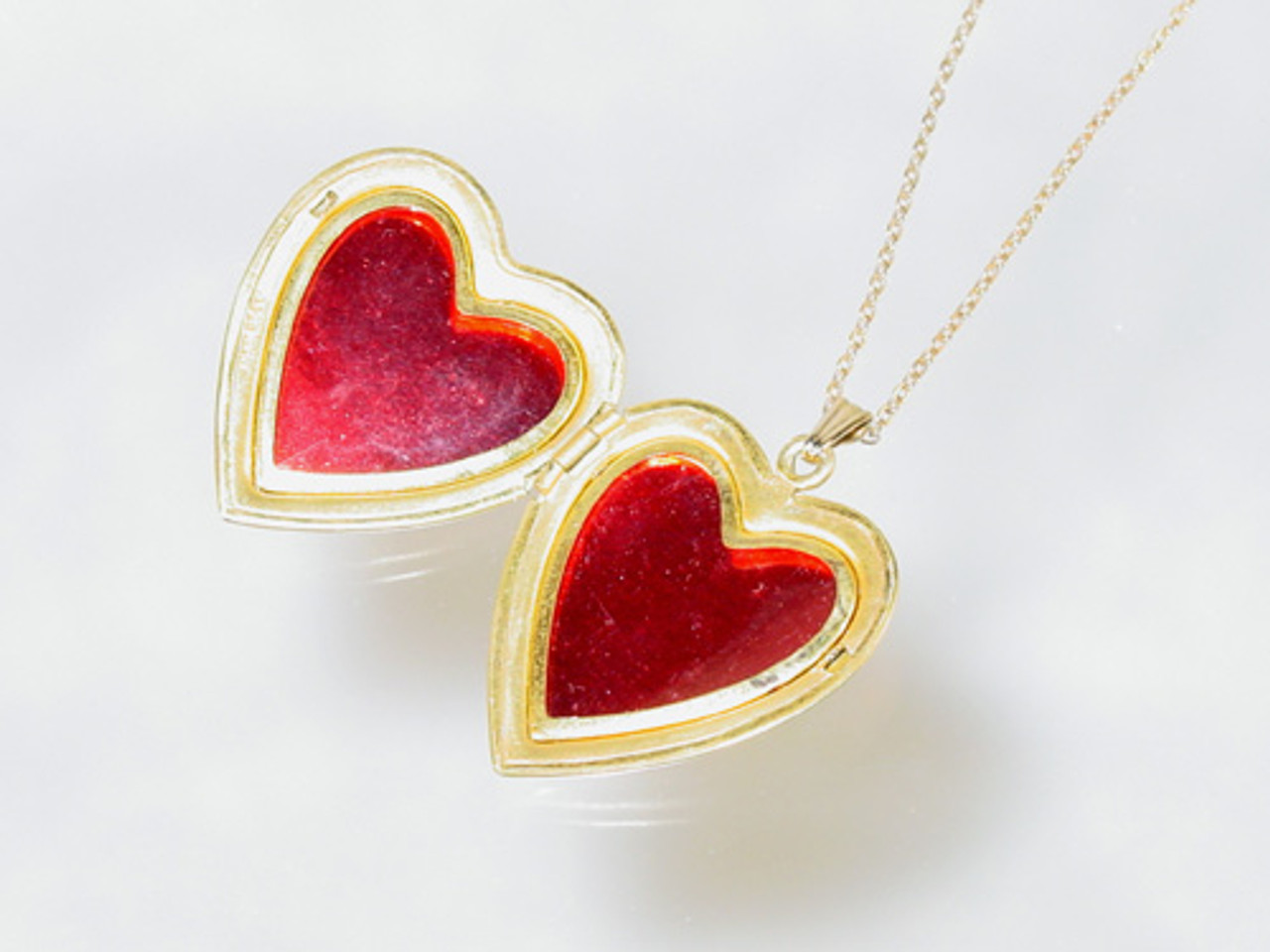 Heart shaped bezels and cellophane in locket