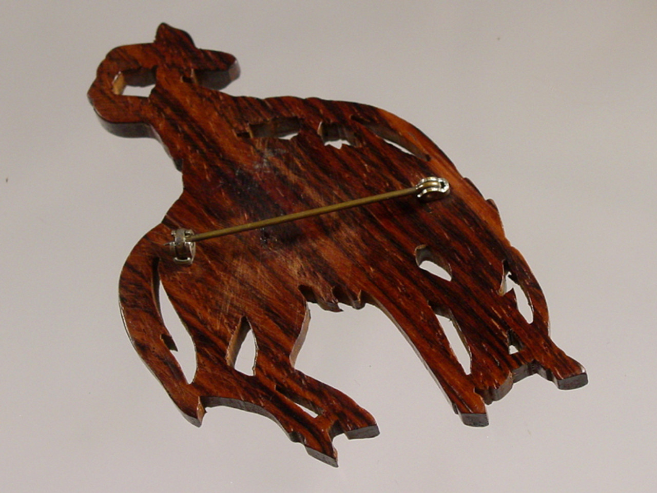 back of carved wood horse brooch back of carved wood horse brooch