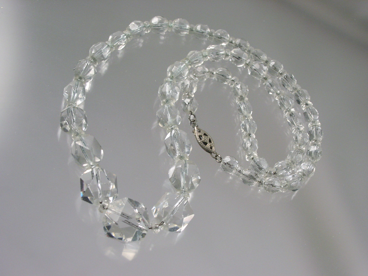 Hand cut geometric crystal on dainty chain