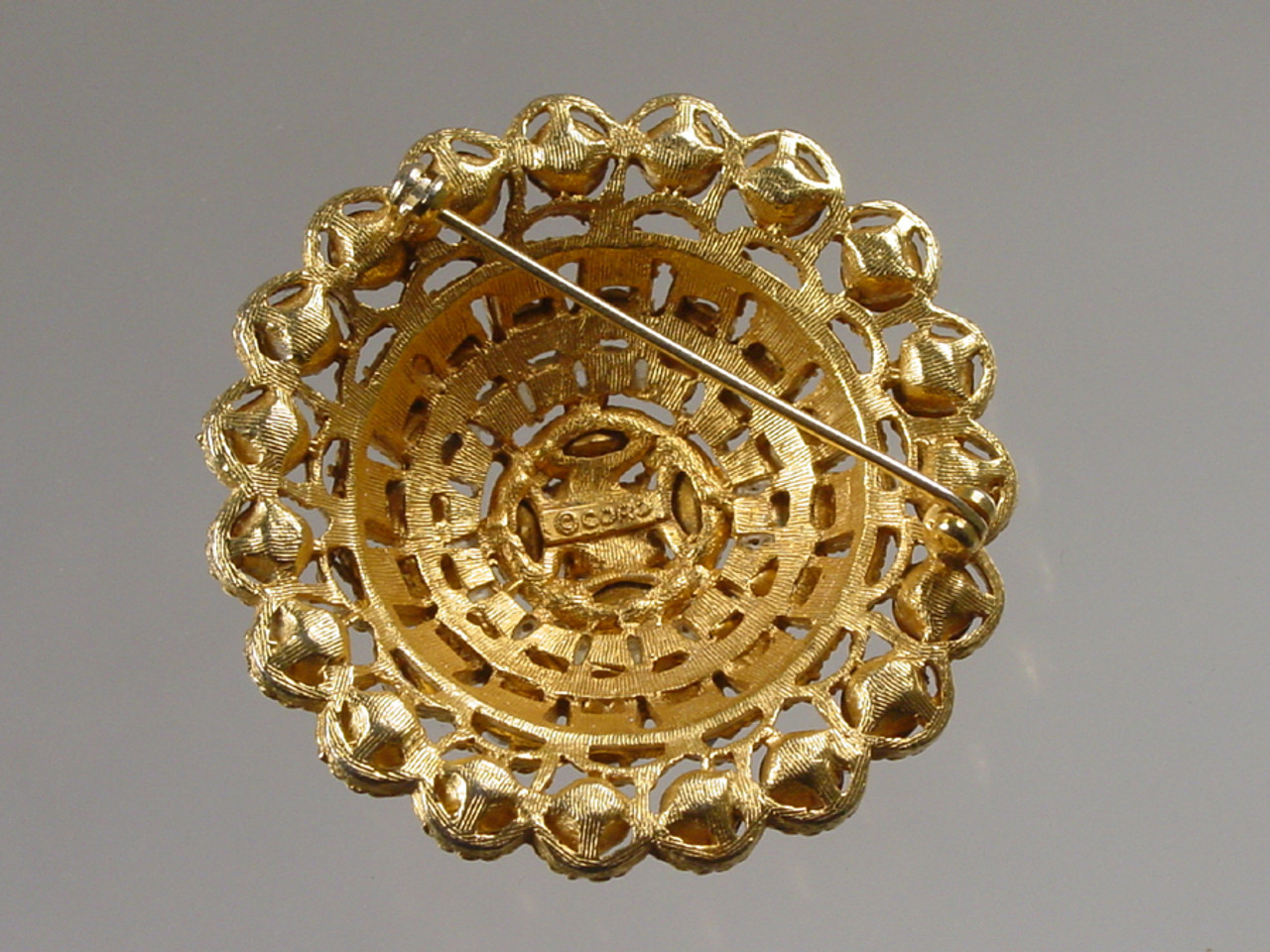 Signed Coro on back of brooch