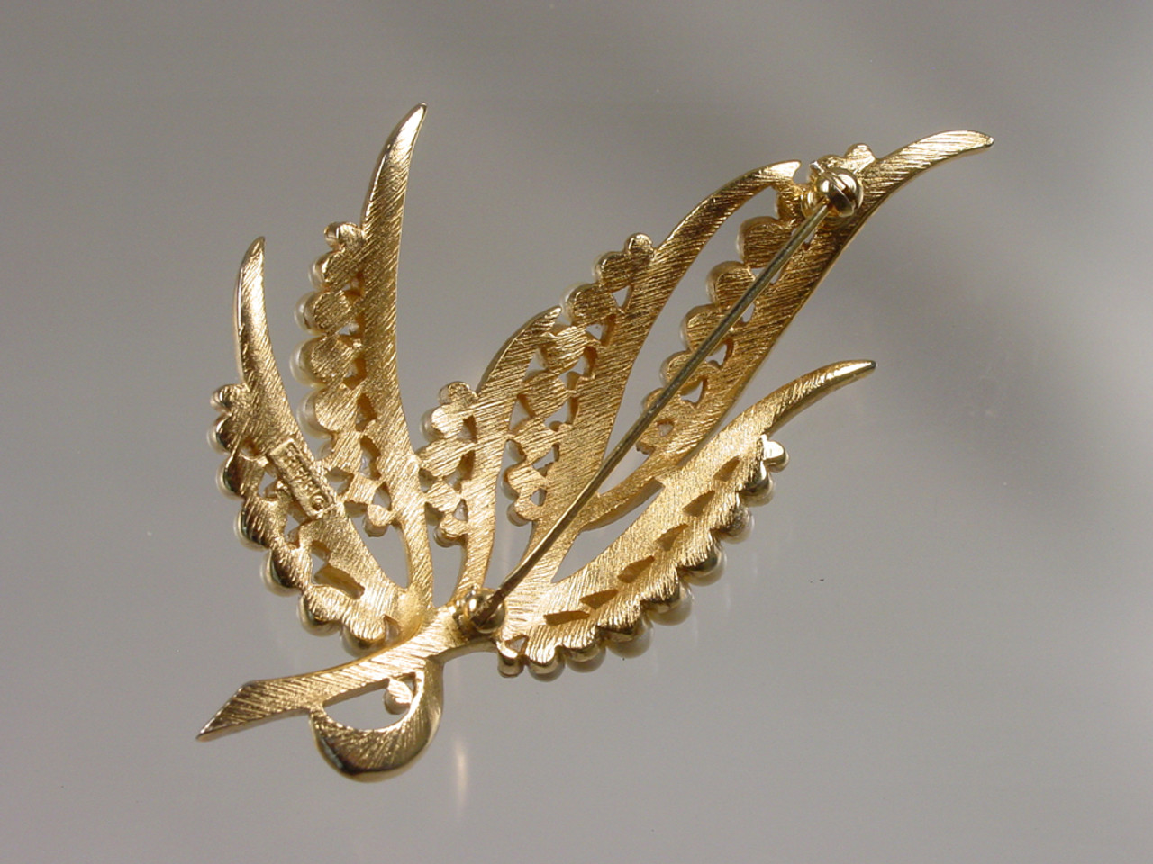 Trifari with crown signature on back of brooch