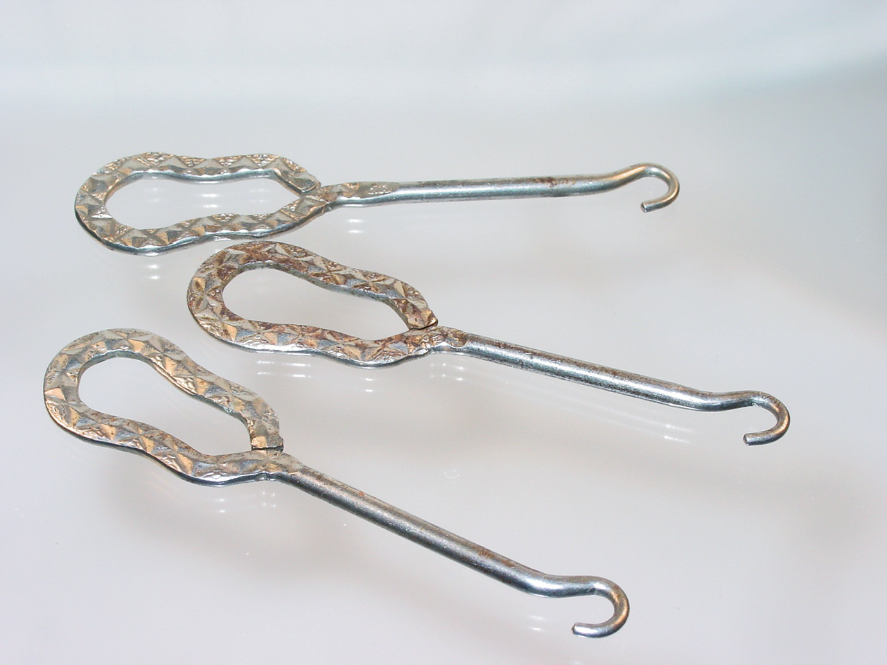 Antique buttonhooks and shoehorns. A buttonhook is a tool used to  facilitate the closing of shoes, gl…