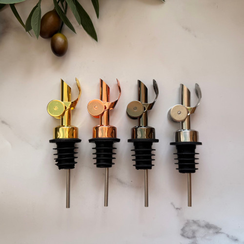 Display showing all 4 colors of our new stainless steal straw gravity pour spouts