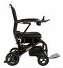 Side view of the Pride Mobility Jazzy Carbon 27 folding power wheelchair with mesh backrest and Black Cherry frame