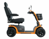 Pride Pursuit 2 heavy duty 4-wheel mobility scooter in orange – side view showing captain’s seat and suspension