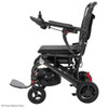 Side view of the Pride Mobility Jazzy Carbon folding power wheelchair with black seat and black frame