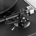 Close crop of the Rega Planar 6 turntable in Polaris Grey's tonearm