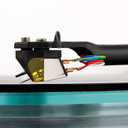 Rega ND7 Cartridge angled view over a record and glass platter