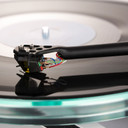 Close crop of the tonearm playing on a record on the Rega Planar 8