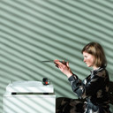 Lifestyle view of Satin Walnut Pro-Ject X2 B Turntable with Ortofon Quintet Red Cartridge