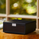 Lifestyle shot of the REL AirShip Wireless Transmitter in Black