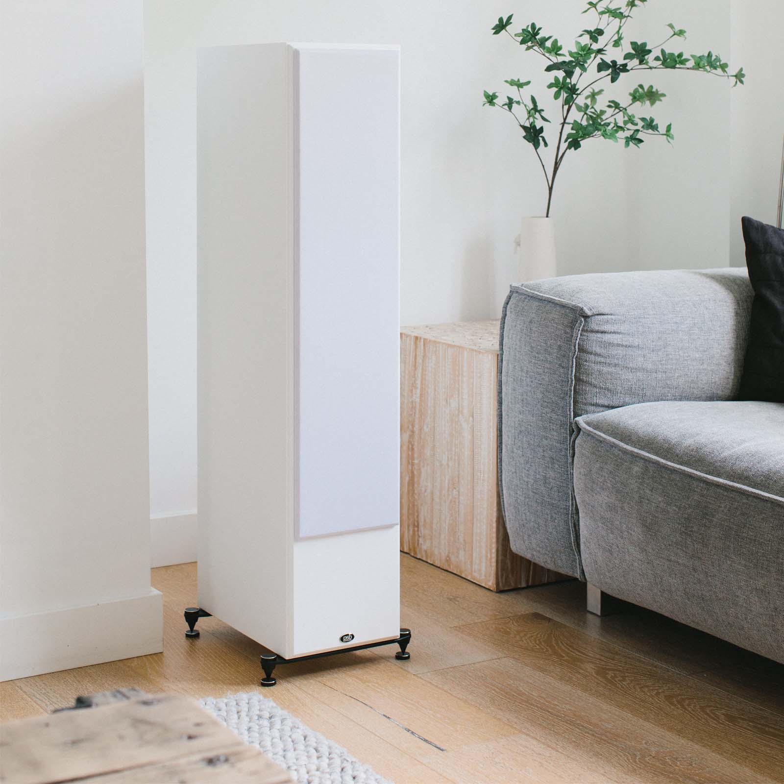 Lifestyle image of PSB Imagine T54 Tower Loudspeaker in a living room in white