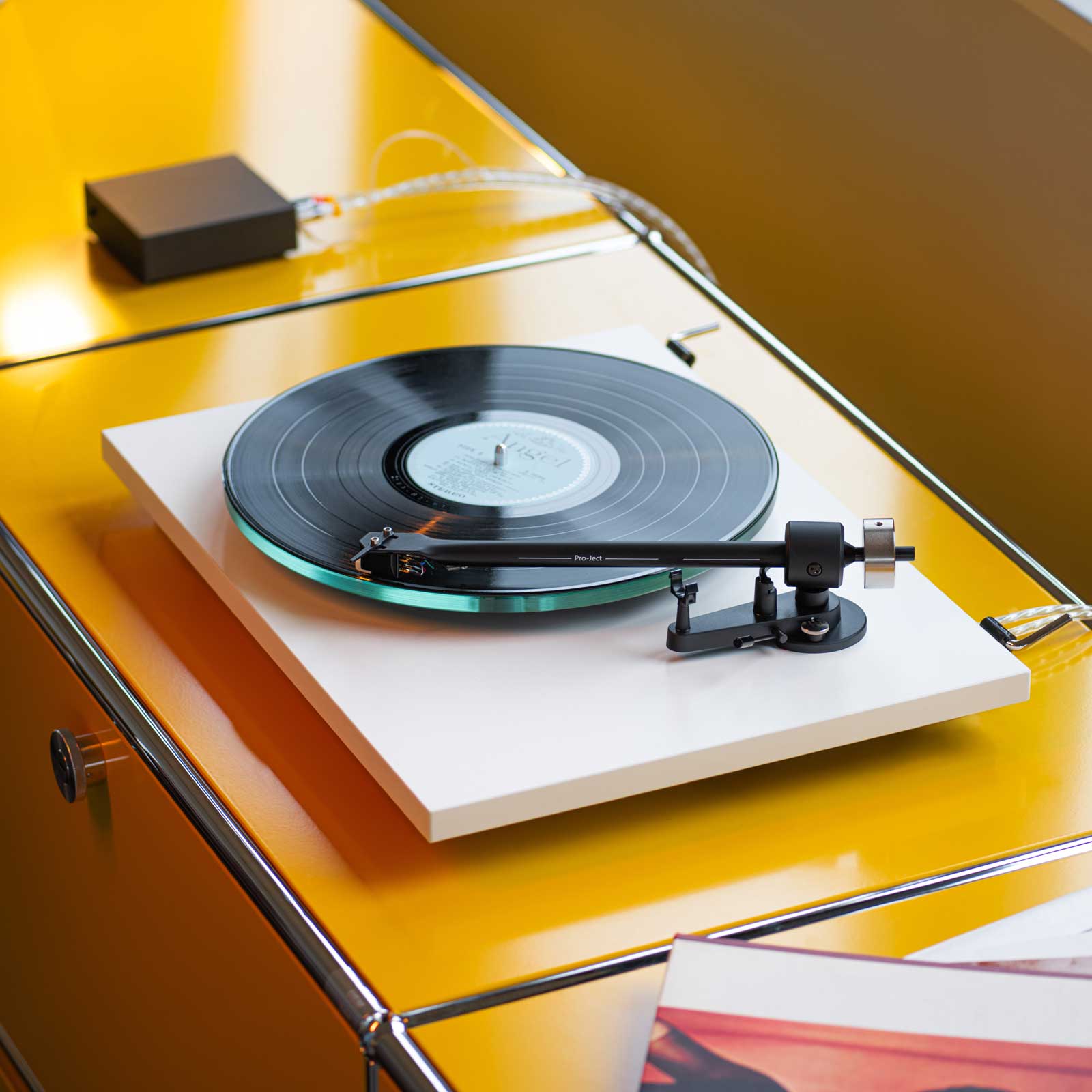 Lifestyle of the Pro-Ject T2 Super Phono Turntable with dustcover in Gloss White with the Sumiko Rainier Cartridge