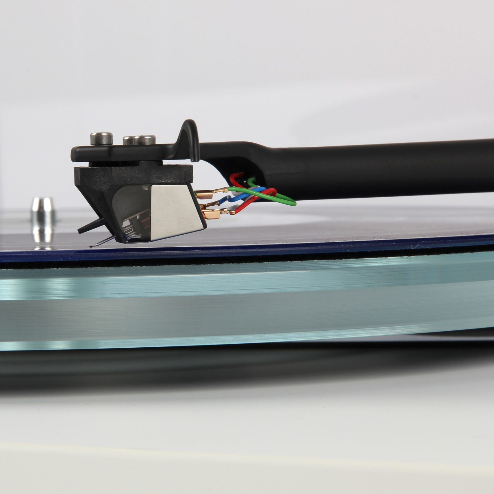 Side view of Rega Nd5 Moving Magnet Cartridge on a record on the Rega Planar 6