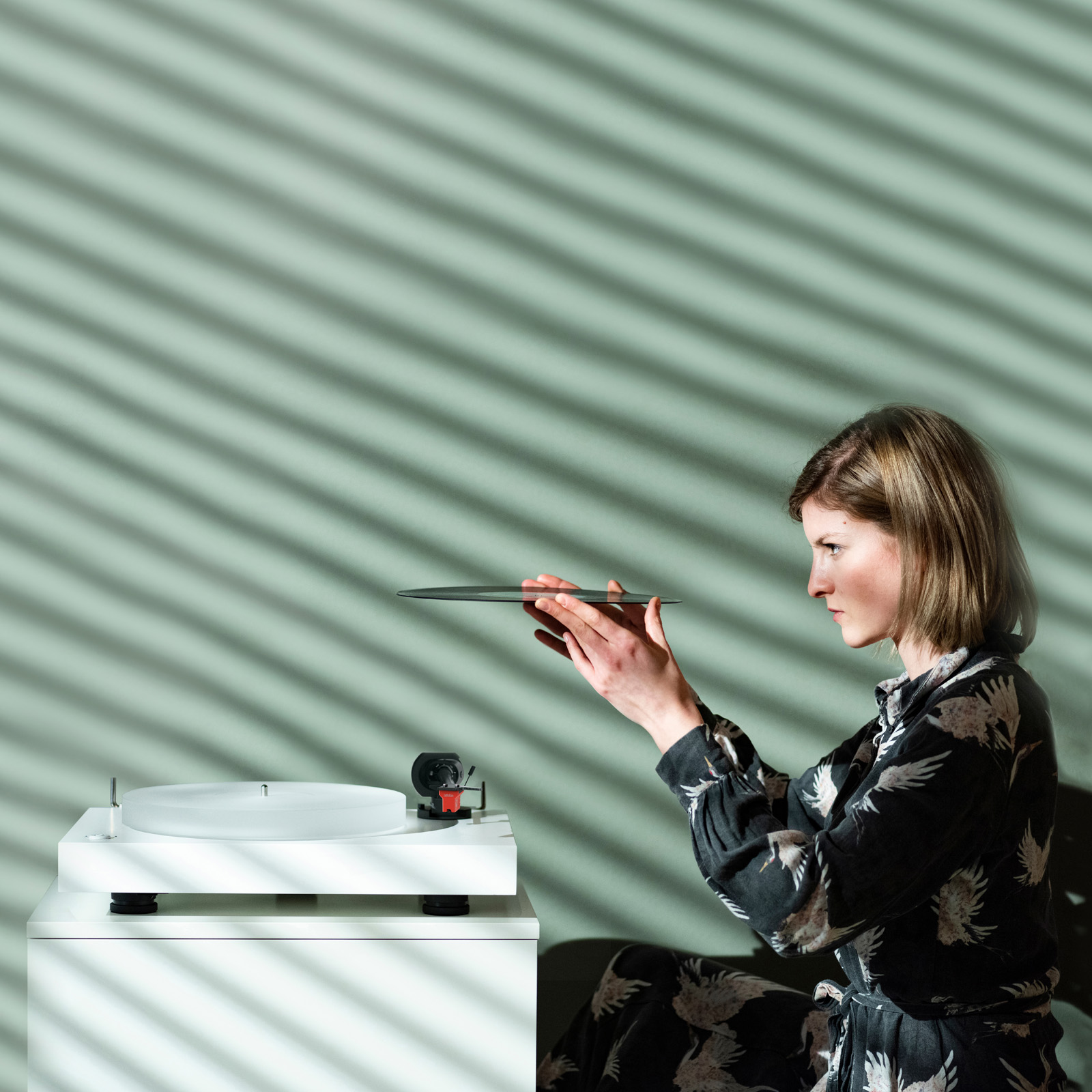 Lifestyle view of Satin Walnut Pro-Ject X2 B Turntable with Ortofon Quintet Red Cartridge