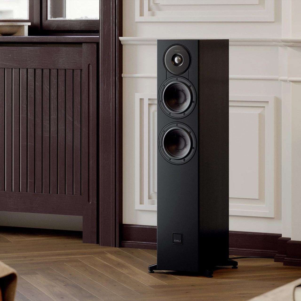 Black Ash DALI SONIK 5 Tower Loudspeaker in living room.
