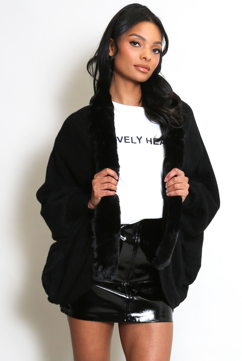 Black cardigan with faux fur trim and cashmere mini skirt