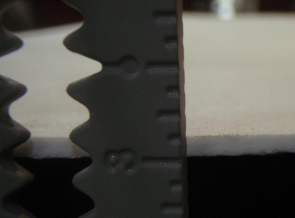 This ruler shows that this gasket is 1/8" thick.