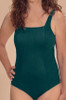 Front view of a woman wearing the Amoena Treviso pocketed one-piece mastectomy swimsuit featuring a premium ribbed textured fabric in an emerald green tone.
