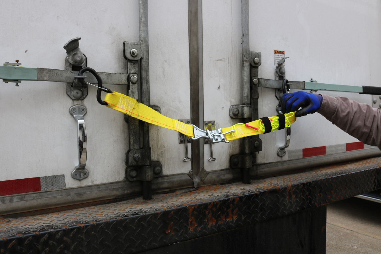 Releasable Trailer Door Limit Strap