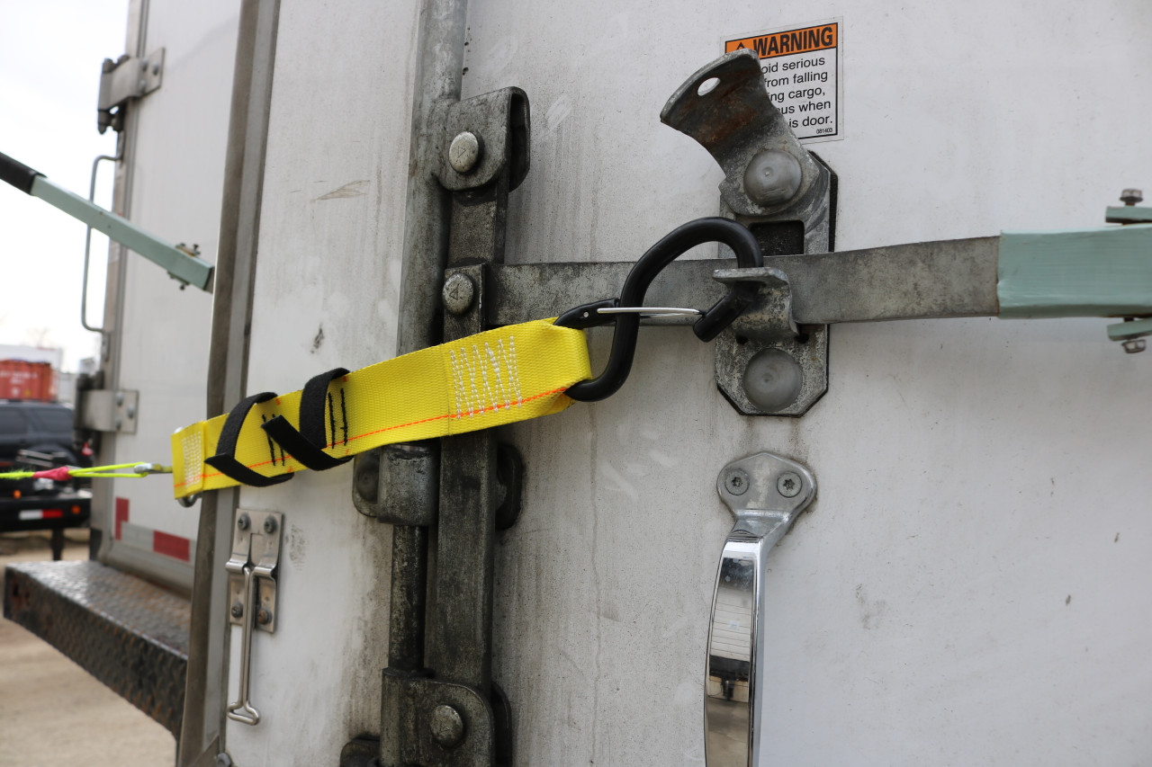 Releasable Trailer Door Limit Strap