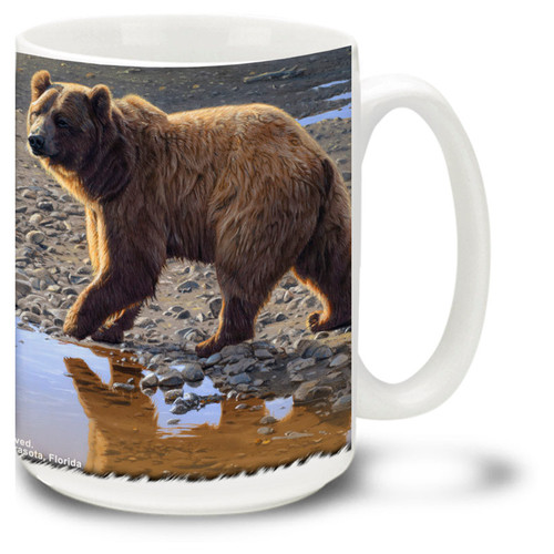 Beautiful bears frolic on the riverbank.