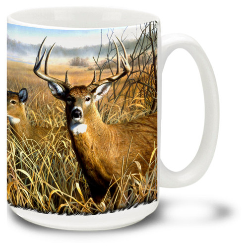 Majestic deer in a grassy field.