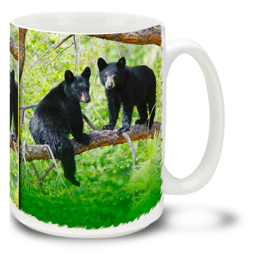 Black bears prefer forested areas, and these little cubs are having fun exploring their surroundings! Climb out of bed in the morning with this black bear cub coffee mug. 15oz Black Bear Cub coffee mug is durable, dishwasher and microwave safe. Have yourself a "cub" of coffee!