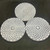 Selenite crystal charging plate holding smaller crystals for recharging