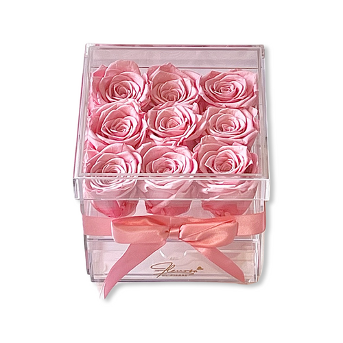 Acrylic box with drawer filled with 9 beautiful blush pink roses. (side)
