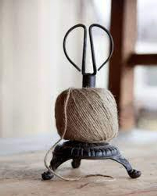 Ball of Twine on Cast Iron with Scissors