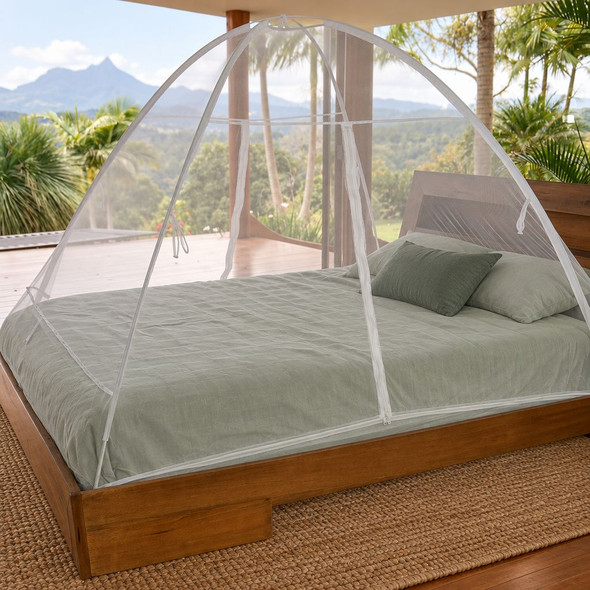 Freestanding mosquito net set up over a king size bed, fits double to king